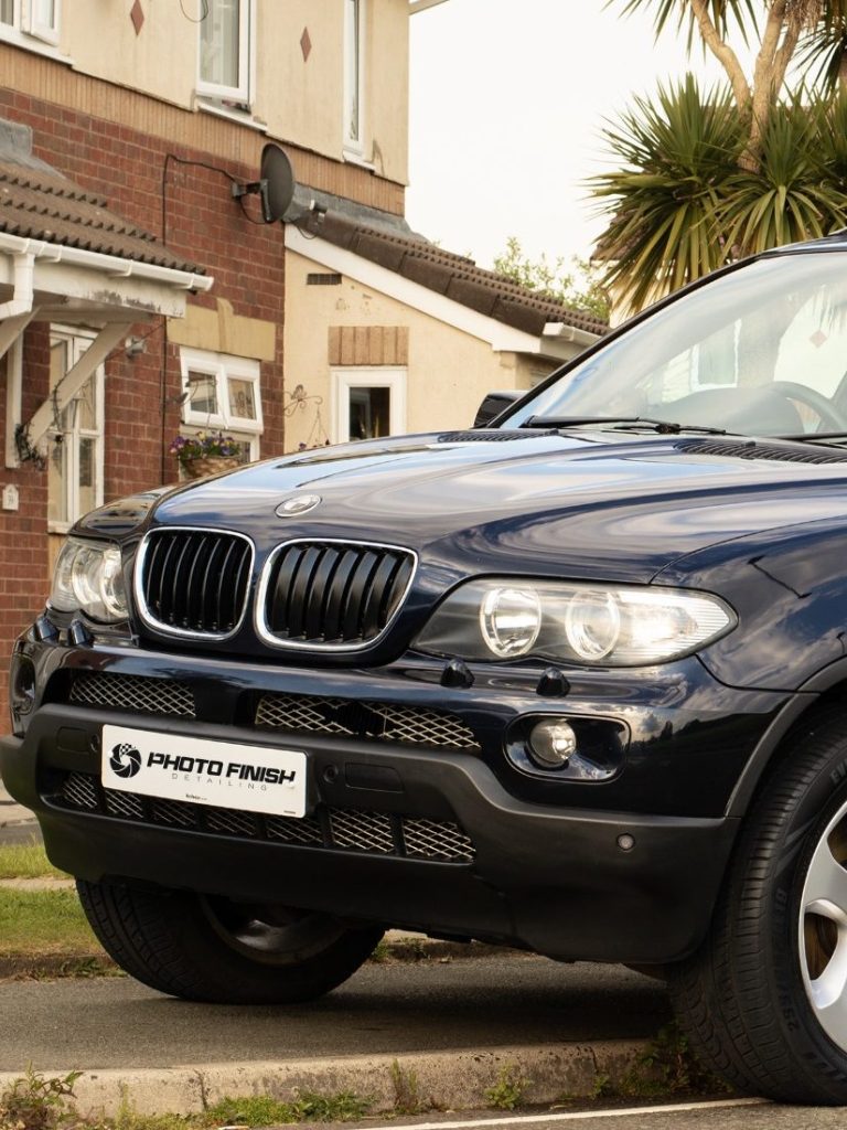Shiny and clean BMW X5 front after a complete detail and paint correction