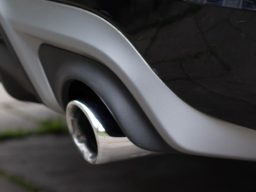 Polished exhaust as part of the exterior detailing service.